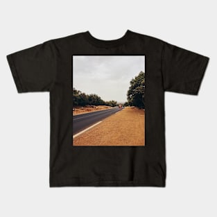 Pilgrim Walking Along Road Kids T-Shirt